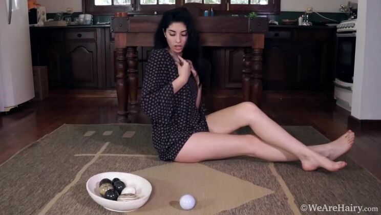 Hairy Ornella Masturbates with Stones Alone