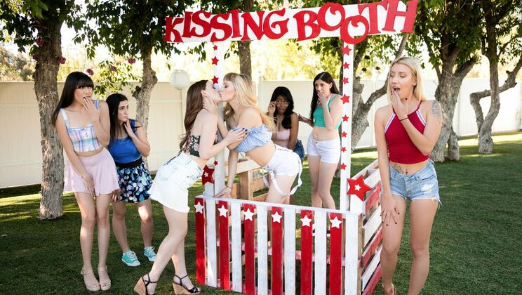 Blonde and Brunette Teens Get Caught at the Kiss Booth