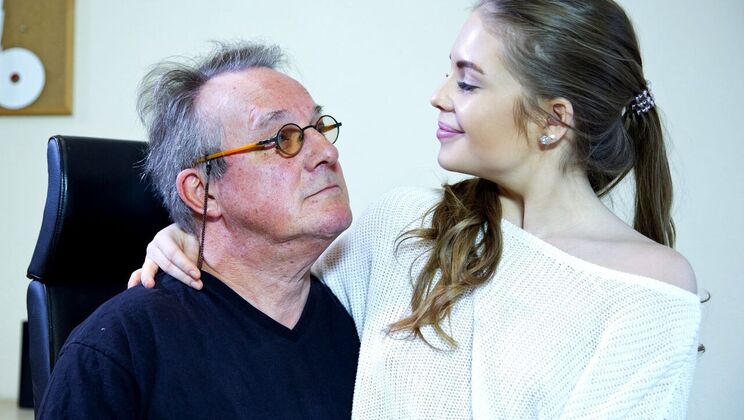 Old Man Enjoys Young Blonde's Company in Bed